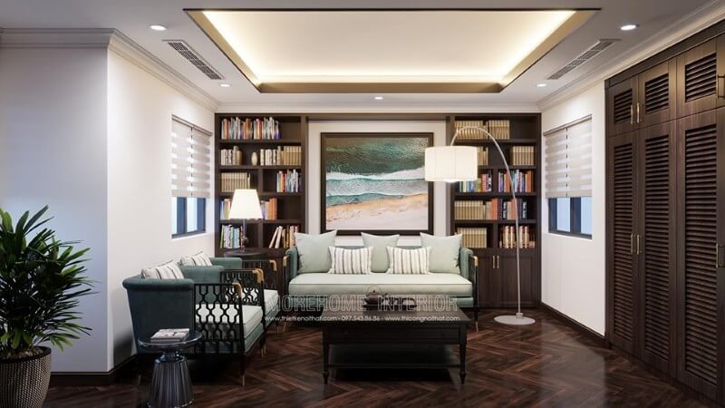 Phòng làm việc được trang trí bằng đèn cây, tranh treo tương và các kệ decor.